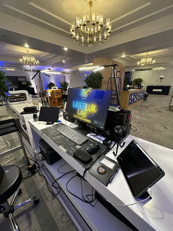 Engraving station at a venue with a chandelier